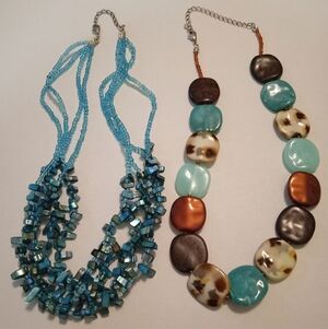 #638.  2 Piece Blue Shell And Acrylic Necklace Bundle